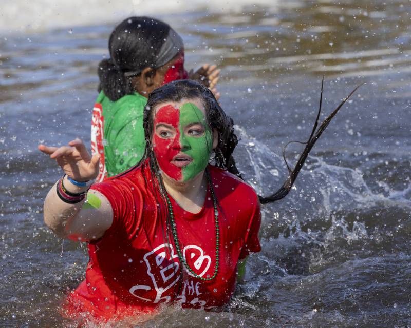 A LaSalle Peru High School student plunger quickly spins to exit the frigid water during the Polar Plunge for Special Olympics on February 22, 2025 at Lake Mendota.