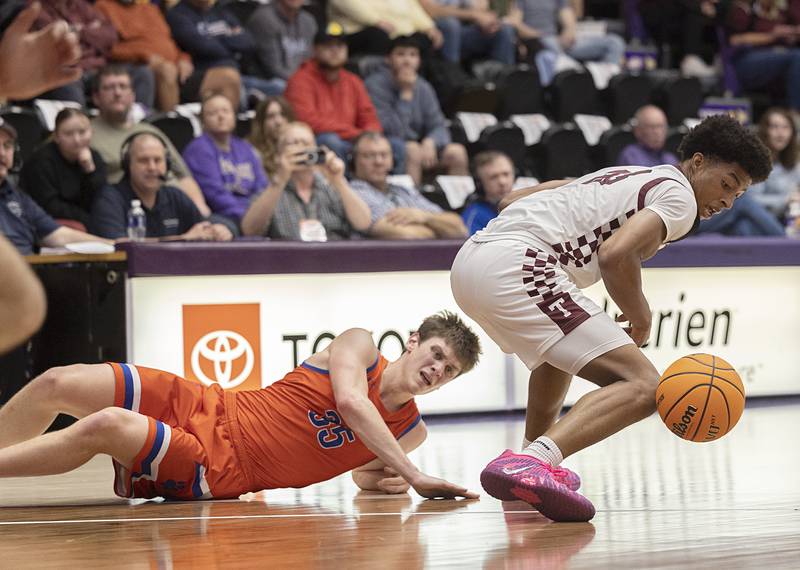 Eastland’s Parker Krugman loses the ball to Tremont’s Brandon Tennon  Monday, March 9, 2026, in the Class 1A Macomb Supersectional.