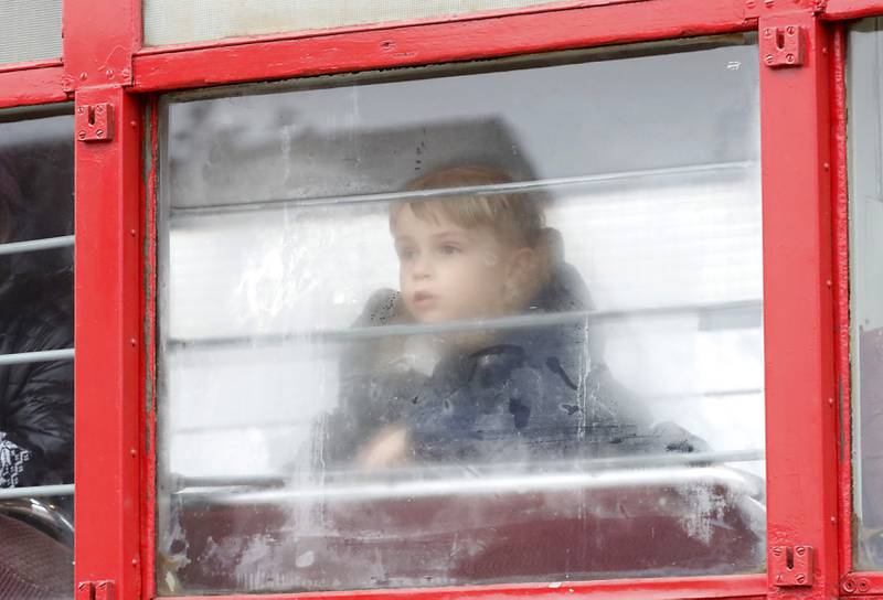 Jacob Green, 4, peers out of a rails car as he rides on a North Shore train Saturday, Jan. 21, 2023, as the Illinois Railway Museum celebrates its 70 anniversary with the first of many celebrations by commemorating the 60 years since the abandonment of the Chicago North Shore and Milwaukee Railroad.