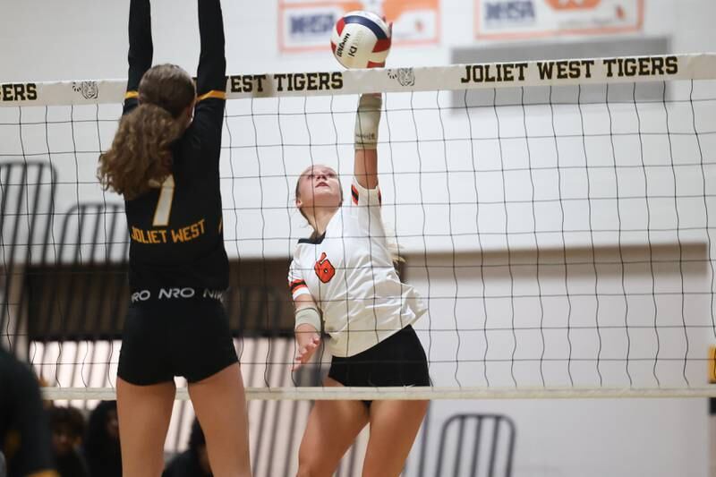 Minooka’s Kendall Kozak goes up for the kill against Joliet West on Tuesday, Sept. 26, 2023 in Joliet.