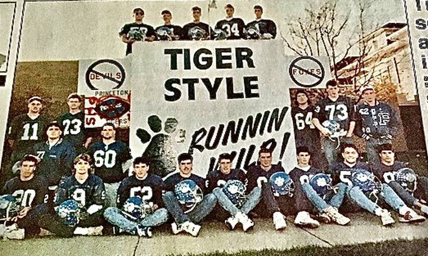 Team captains for the 1989 Princeton Tigers, Kirk Stevens (left), Doug Bruyn, Chad Hamel and Kipp Wahlgren, proudly display the Class 3A State Runner-up trophy they brought home. No PHS team has reached the state finals since.