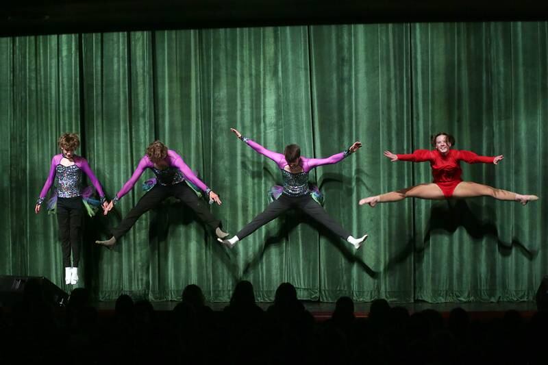 Ottawa Township High School students (from left) Carcin Hgie, will Goetz, and Daniel Bruner try to imitate a ballet move by student Whitney Stone during the 48th annual Fine Arts Festival on Thursday, March 17, 2022 at Ottawa High School.