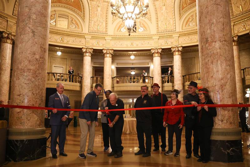 Third generation stage hand Bob Kelly cuts the ceremonial ribbon at the Rialto Theater’s 100th anniversary celebration on Sunday, May 3, 2026 in Joliet.