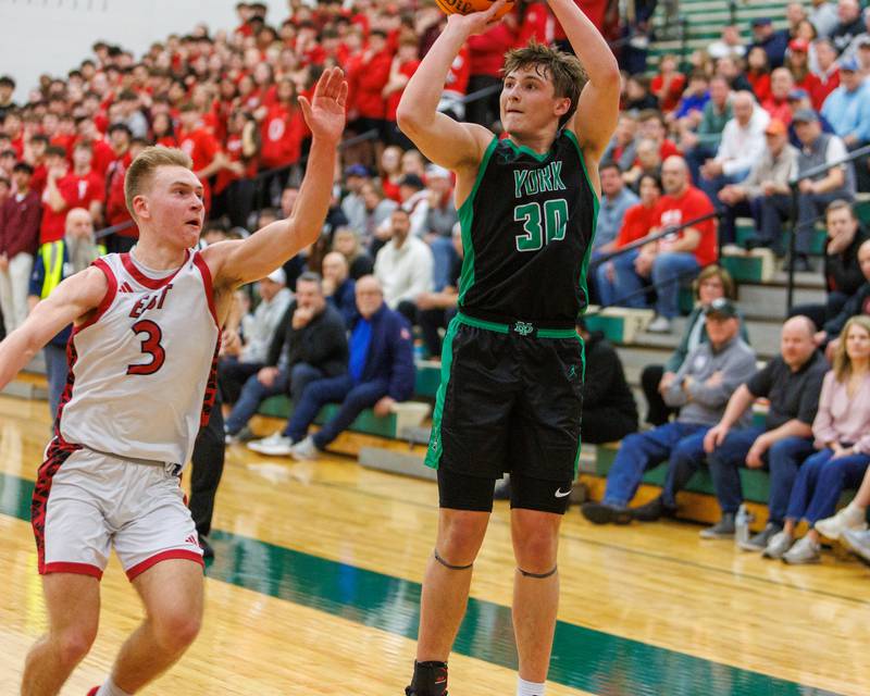 York's Will O'Leary shoots a jumper over Glenbard East's Danny Snyder at the Class 4A Bartlett Sectional Final on Friday, March 6,2026 in Bartlett.