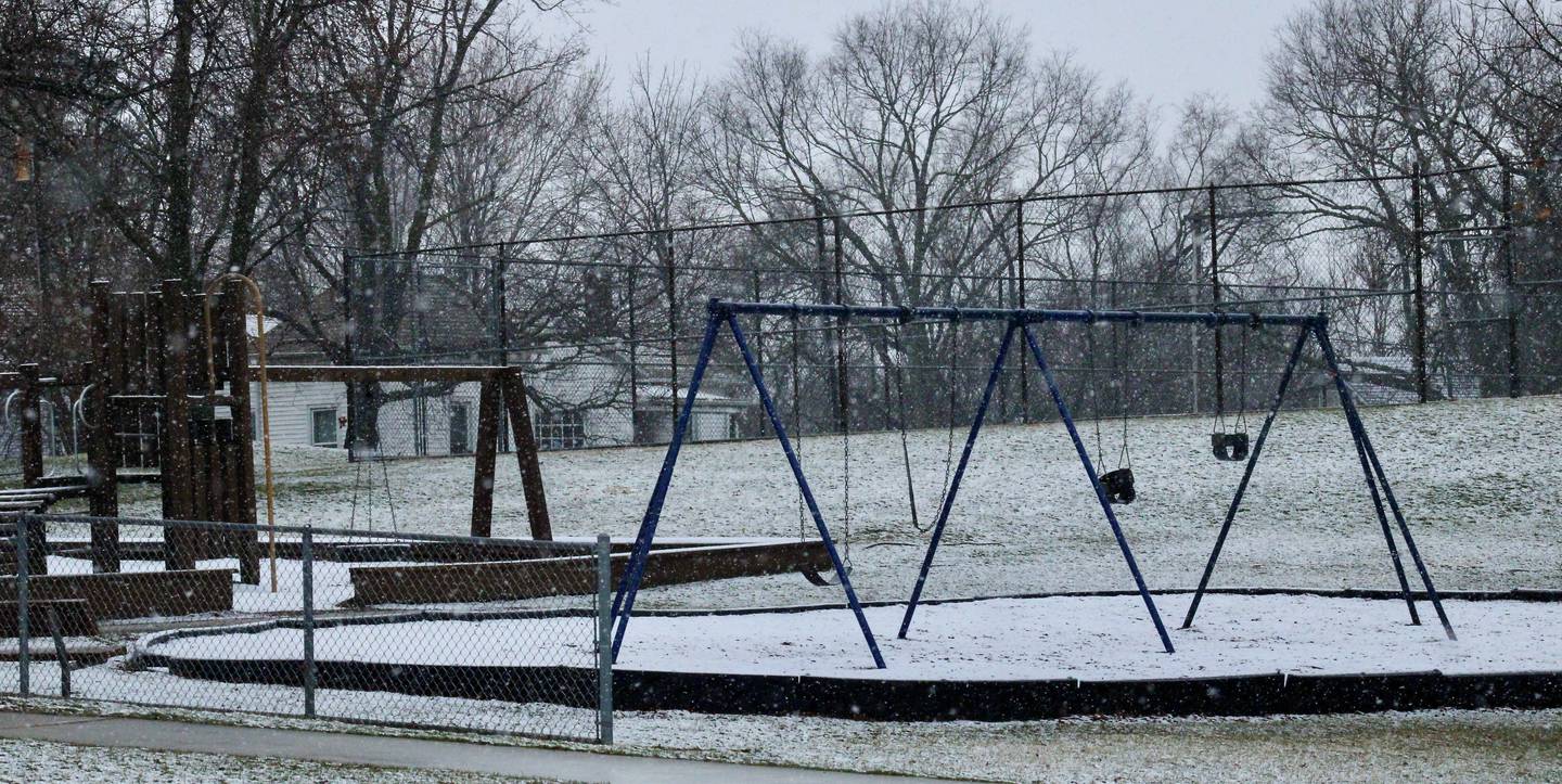 Snow accumulates on the ground at E.C. Smith Park in Dixon on Thursday.