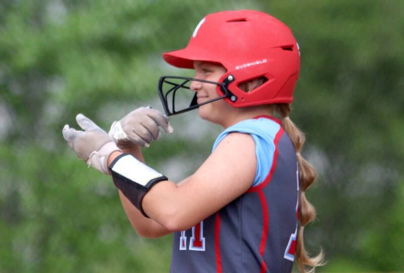 Marian Central’s Holly Garrelts reacts after connecting for an RBI single as the Hurricanes faced Winnebago to begin an IHSA Class 2A Regional game at Raymond Benoy Field in Woodstock Monday.