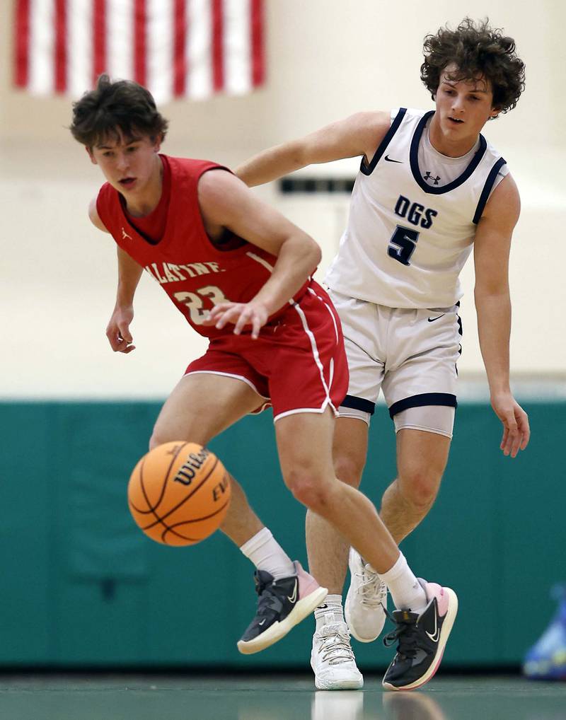 Palatine’s Carter Monroe (23) and Downers Grove South’s Wyatt Wawro (5) nearly collide during the Jack Tosh Holiday Tournament Thursday, Dec. 26, 2024 at York High School in Elmhurst.