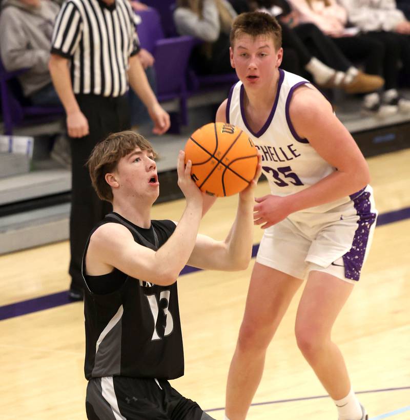 Kaneland's Bryce Goss pulls up for a jumpshot in front of Rochelle's Eli Schweitzer Tuesday, Feb. 3, 2026, in their game at Rochelle High School.