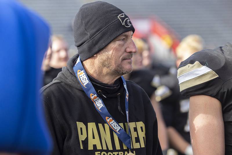 Lena-Winslow head coach Ric Arand waits for the first place trophy Friday, Nov. 28, 2025, in the Class 1A football finals at Hancock Stadium at ISU.