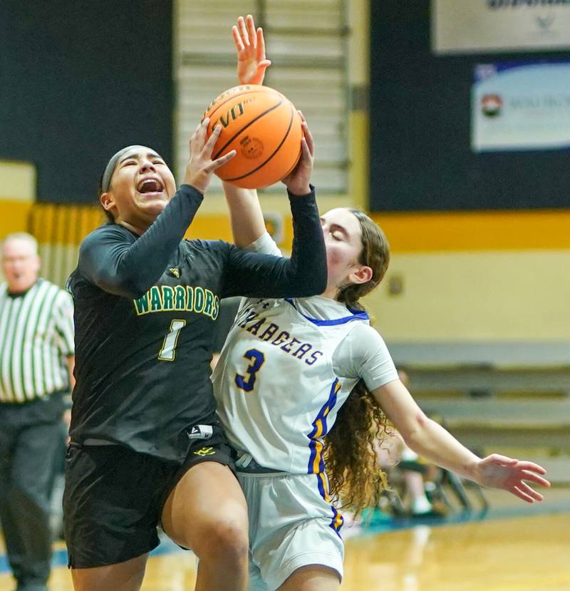 Waubonsie Valley's Arianna Garcia-Evans (1) drives to the basket against Aurora Central Catholic's Gina Dutkanych (3) during a basketball game at Aurora Central Catholic High School on Thursday, January 30, 2025.