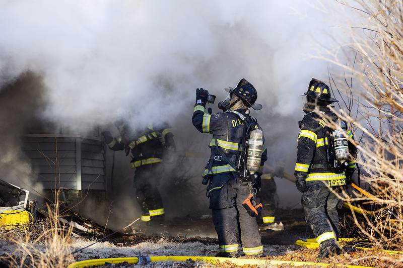 Firefighters work the scene of a fire Sunday, Jan. 19, 2025, at 550 Mill Street in Emerson.