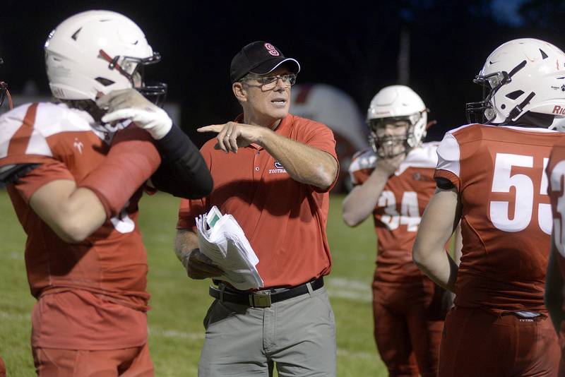 The Streator Bulldogs get fired up by the coaching staff on a timeout Friday during the game against Manteno Friday at Streator.