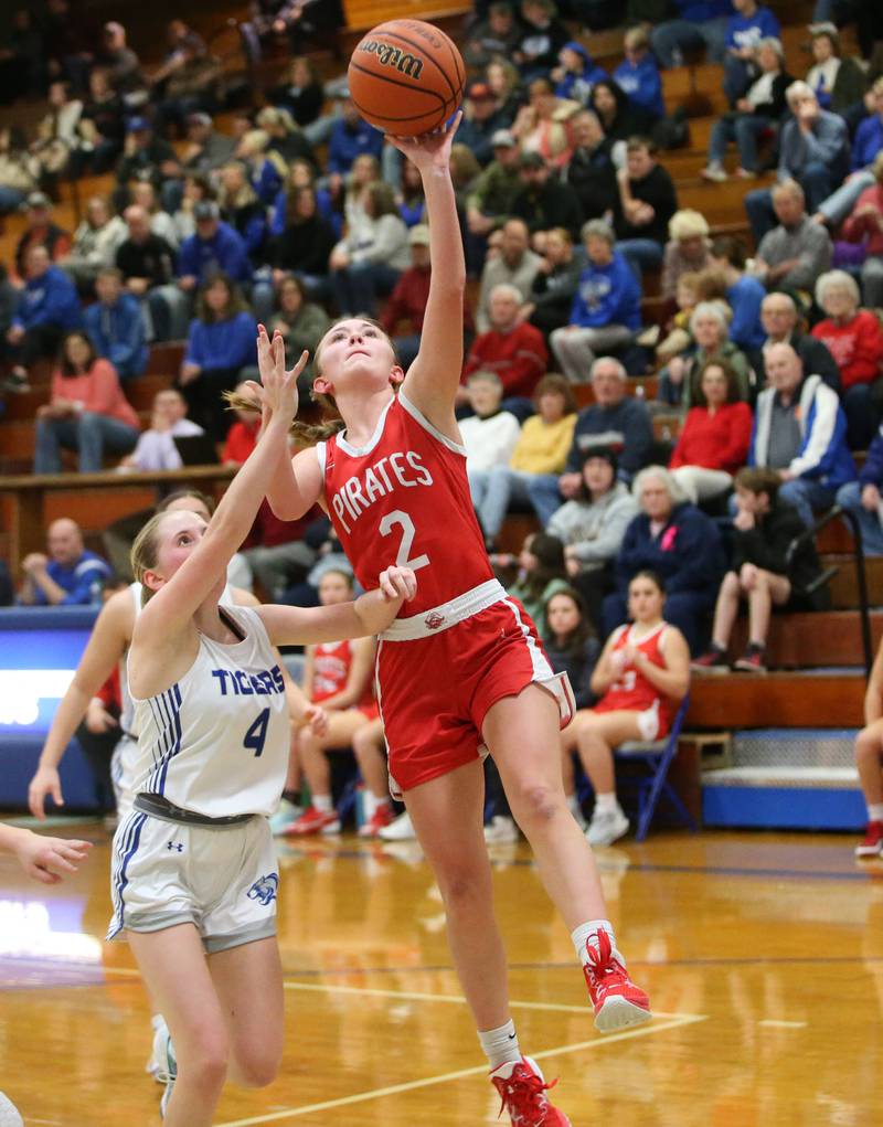 Ottawa's Ashlynn Ganiere runs in front of Princeton's Paige Jesse on Monday, Feb. 5, 2024 in Prouty Gym.