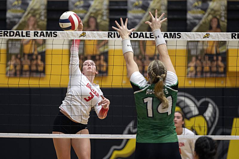 Oregon’s Lexi Ebert plays a shot in front of Rock Falls’ Ari Reyna Tuesday, Oct. 24, 2023 at the Riverdale volleyball regional.