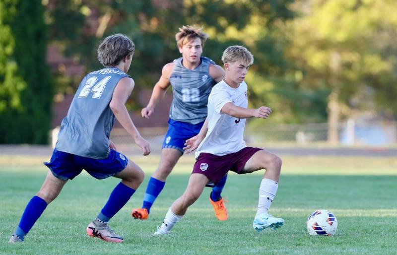 IVC's Drew Marquis dribbles between's Princeton's Brayden Clevenger (24) and Izaiah Smalllwood (22) in Thursday's match at the Bryant Field pitch. Marquis is the son of PHS grads Alex and Jordan (Baker). Marquis.