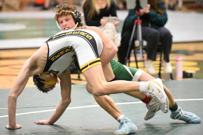 Coal City's Brody Widlowski, right, takes down Herscher's Owen Bollino during the Illinois Central Eight Conference 150-pound championship at Coal City Saturday, Jan. 24, 2026.