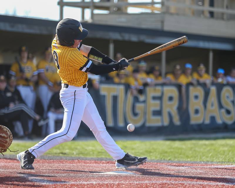 Joliet West's Ayden Lasson (18) swings at a pitch during varsity baseball game between Oswego East at Joliet West.  April 10, 2023.