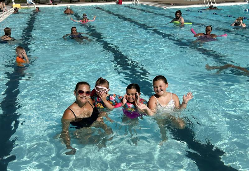 Stephanie Grobe and Maddie Peterson, 8, Olivia Demus, 7, and Kya Demus, 4, pose for a photo in the Polo Pool on Monday, July 28, 2025. Grobe lives in Byron, but grew up in Polo and brought the kids to the pool to beat the heat.
