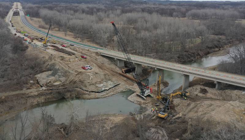 Crews with the Illinois Department of Transportation work on replacing a bridge structure on Interstate 180 over the Tiskilwa Bottom Road on Tuesday, March 18, 2025. According to IDOT, the $24.2 million dollar project includes replacing beams and decking on the current bridge.  During the replacement, only one-lane of traffic in each direction is using the northbound lanes as work happens on the southbound bridges. When that work is complete, traffic will be switched to the southbound lanes to begin work on the northbound bridges.