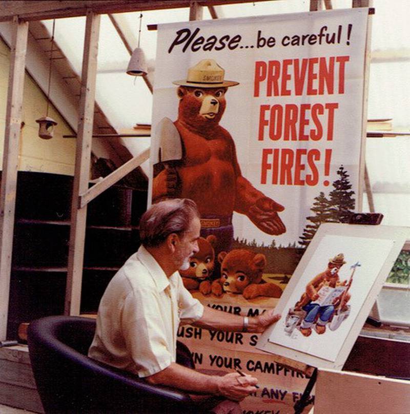 Artist Rudolph “Rudy” Andreas Michael Wendelin works on a Smokey Bear painting in his studio. Nineteen of his paintings will be on display during an exhibit at five Will County nature sites from Jan. 17-March 2, 2025. (Photo courtesy of Elizabeth Wendelin. Smokey Bear images are used with the permission of the USDA Forest Service.)