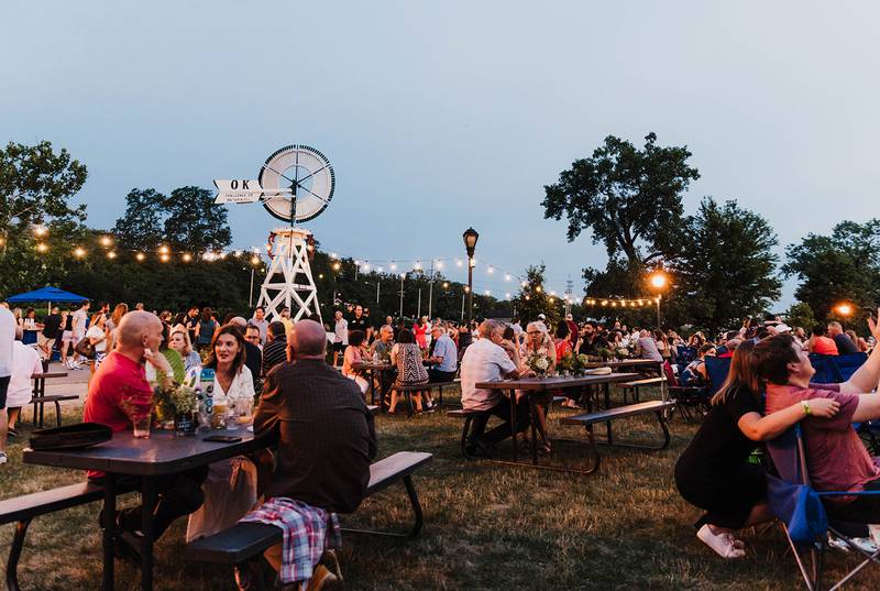 Community members help raise funds for Batavia's MainStreet's support for local businesses at the annual 'Cocktails in the Park' fundraiser.