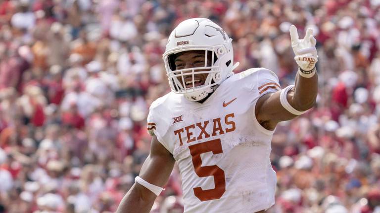 Texas running back Bijan Robinson celebrates a touchdown against Oklahoma at the Cotton Bowl, Saturday, Oct. 8, 2022, in Dallas.