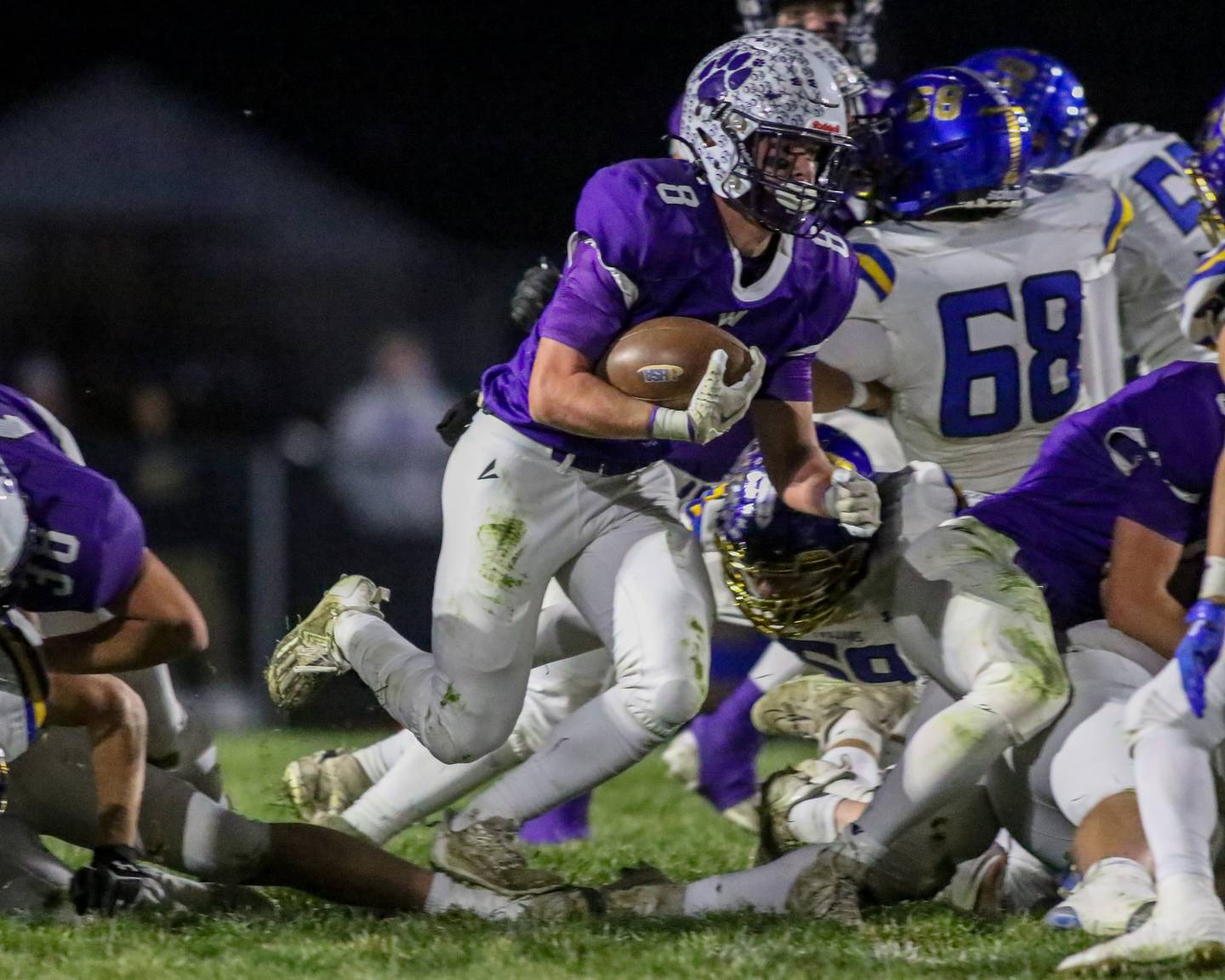 Wilmington's Kyle Farrell (8) bursts up the middle during Class 2A semi-final playoff football game between Moroa-Forsyth at Wimington.  Nov 18, 2023.