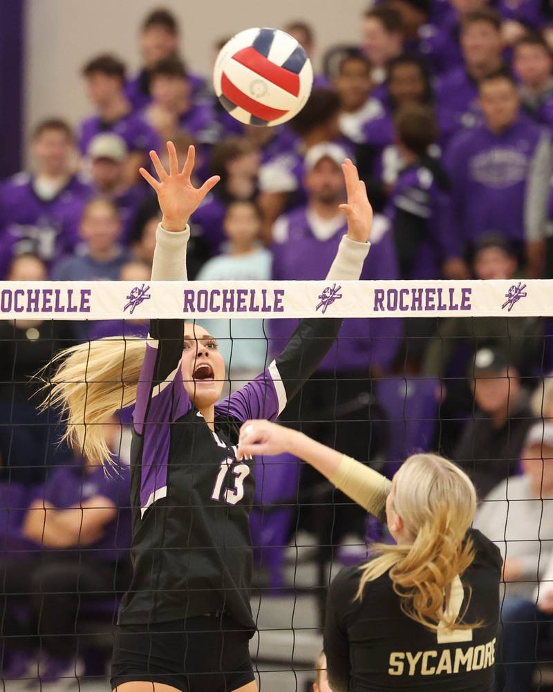 Dixon’s Solis Thompson tries to block the tip of Sycamore's Madilyn Patton Thursday, Oct. 30, 2025, during their Class 3A regional championship match in Rochelle
