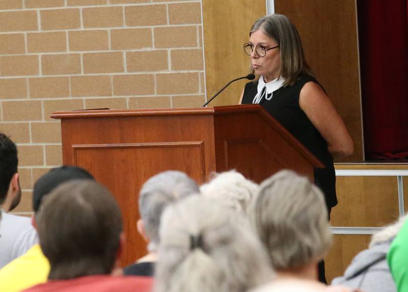 Ann Stevens retired OSF employee, speaks to the Illinois Health Facilities and Services Review Board during a public hearing regarding OSF St. Elizabeth Hospital's plans to reduce services on Tuesday, June 10, at Central Intermediate School in Ottawa.