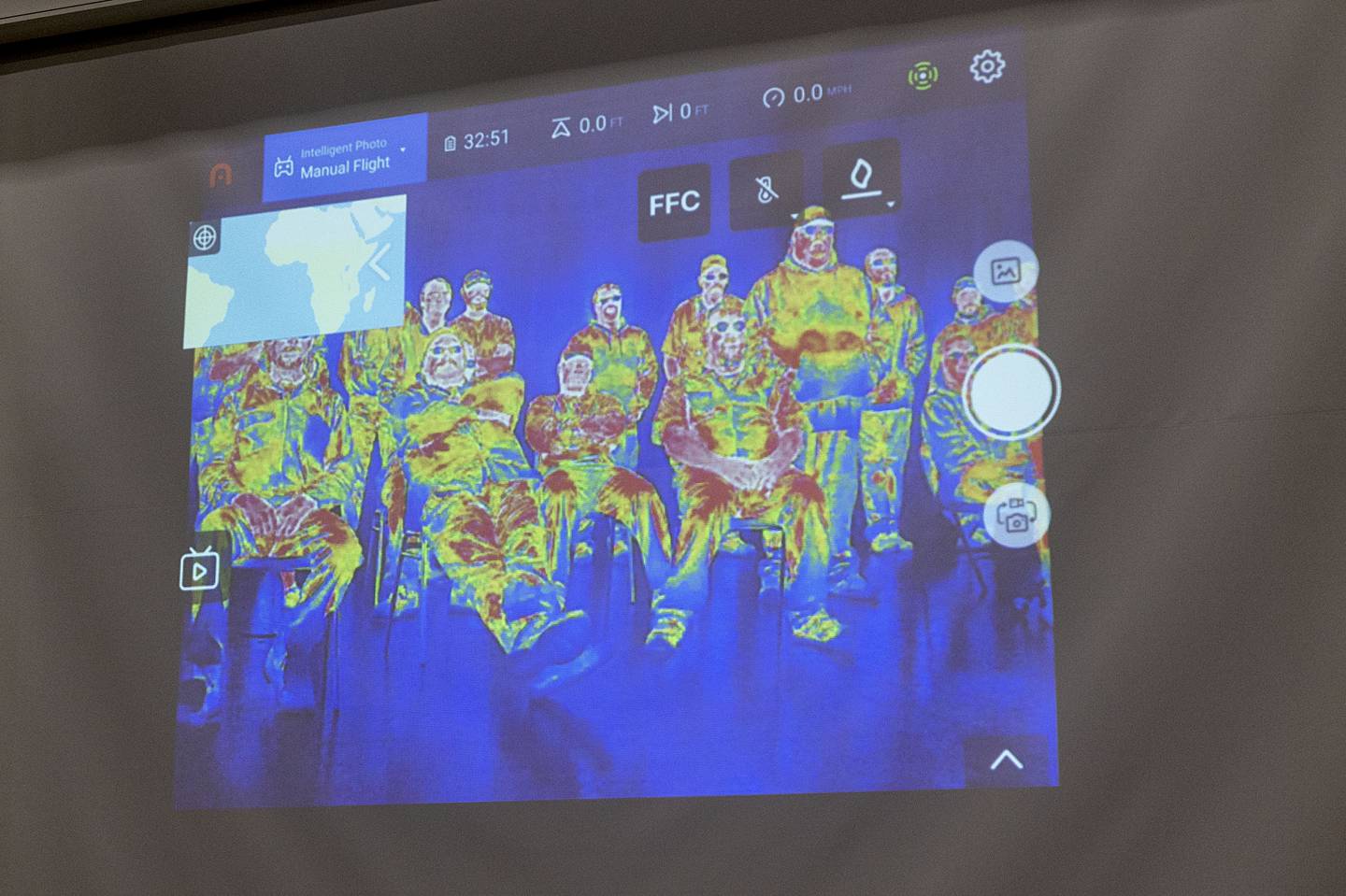 The drone is equipped with a thermal sensor making fighting fires and finding people quicker and safer. Here, Lohse demonstrates the sensor on the group at Sewer Equipment.