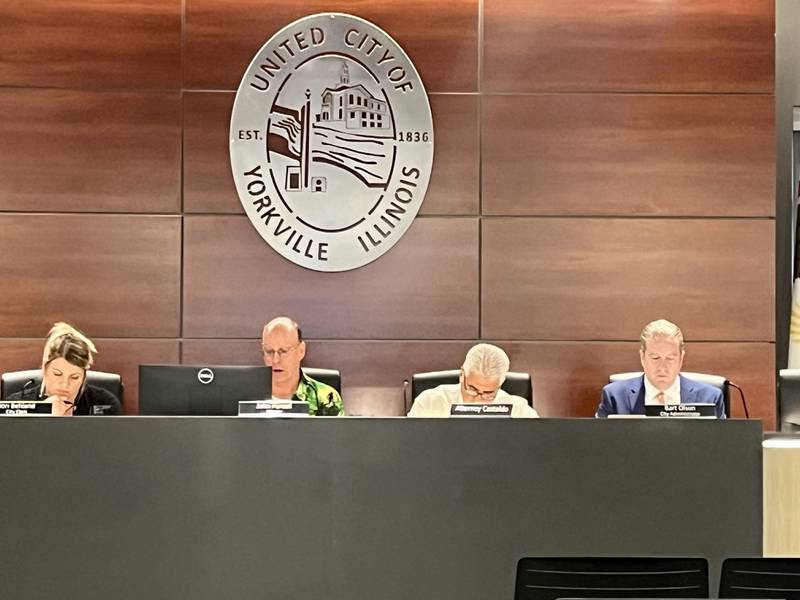 Yorkville Mayor John Purcell (second left) and City Administrator Bart Olson (far right) address the City Council at the Aug. 27 meeting.