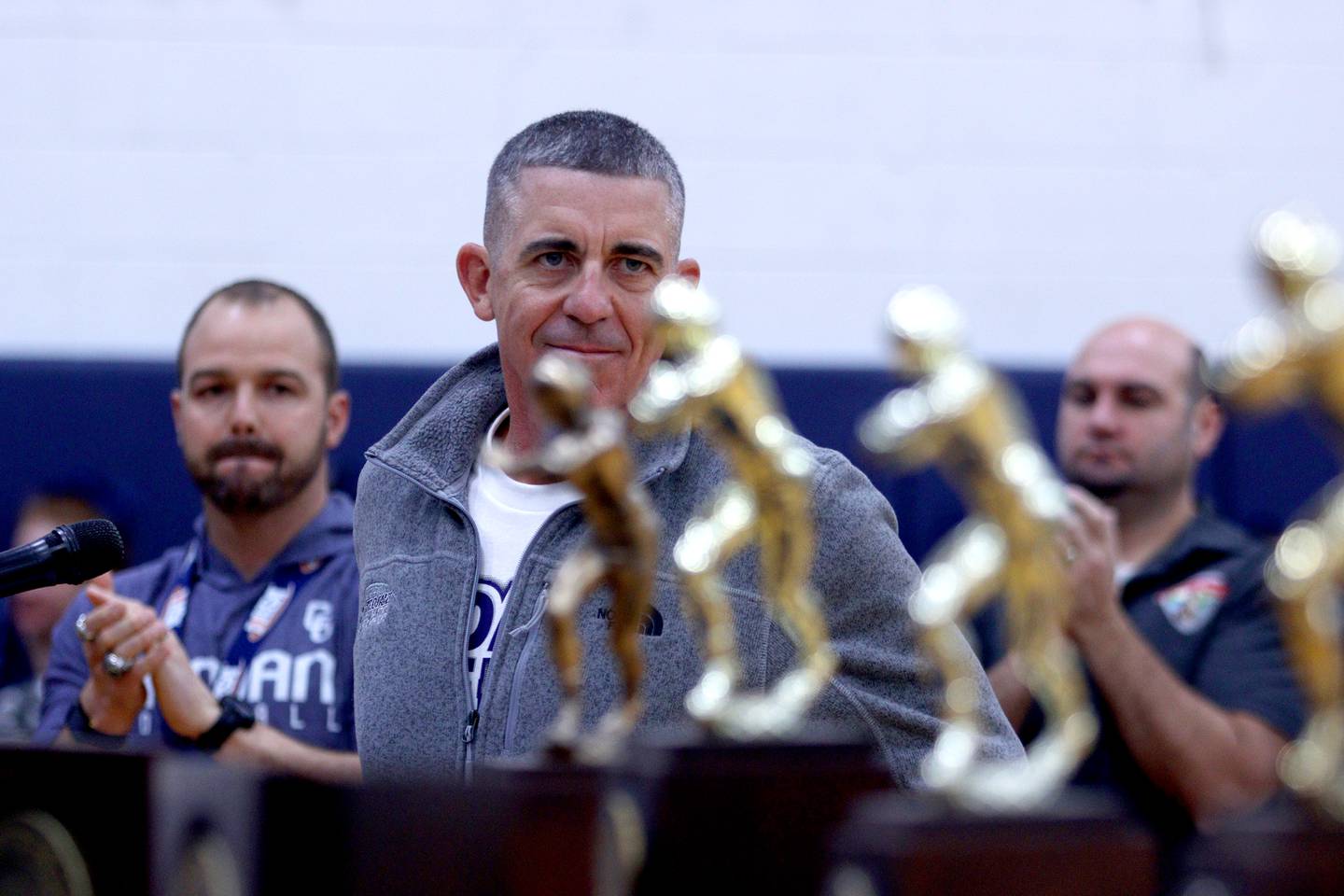 Head Coach Brad Seaburg addresses the audience during a celebration of the IHSA Class 6A Cary-Grove football team at the high school Sunday.