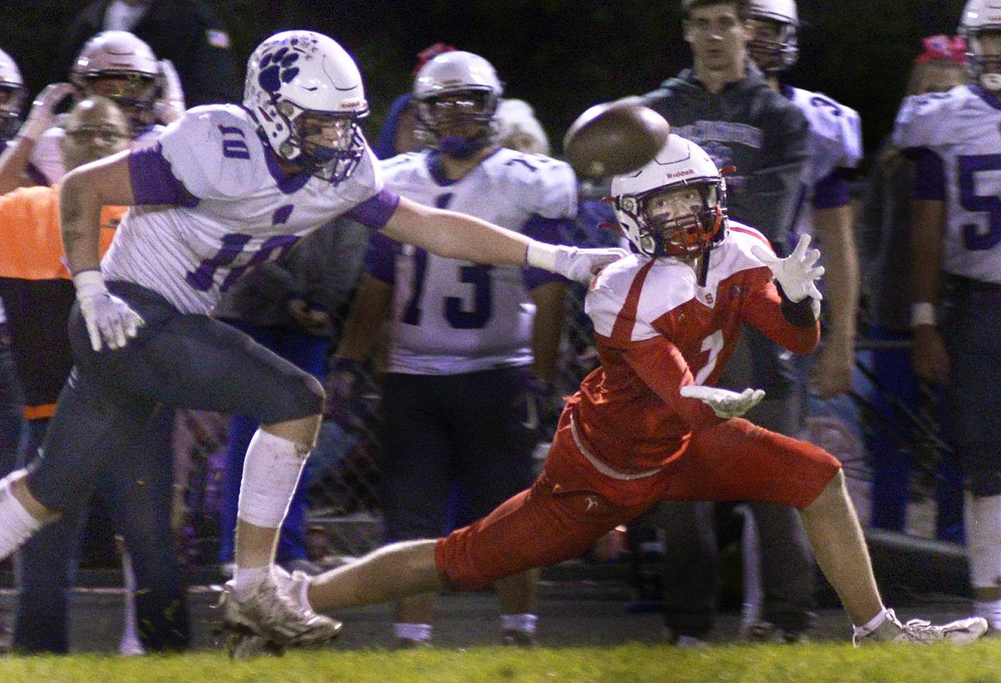 Streator’s Matt Williamson (7) extends to haul in a pass as Wilmington’s Reid Juster (10) defends Friday, Oct. 20., 2023, in Streator.