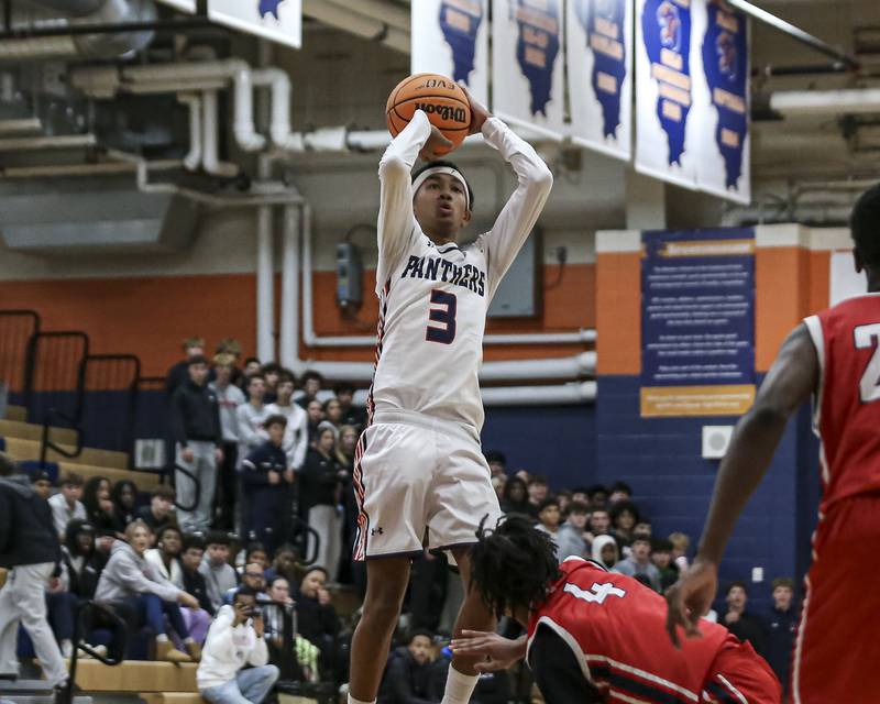 Oswego's Ethan Vahl (3) shoots a fade away jumper during their basketball game between West Aurora at Oswego Monday, Nov 24, 2025 in Oswego.