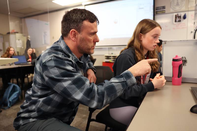 Rodger Ebert, a technology education teacher at Lockport Township High School, works with Lucy Hynes on a project. Ebert received the school's Maroon Award during the 2021-2022 school year for going “above and beyond” to help the students, according to the award description. Wednesday, April 20, 2022, in Lockport.
