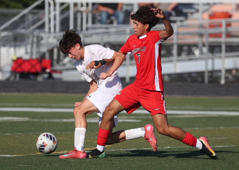 Sycamore's Leo Padilla (left) tries to hold off Yorkville's Oliver Villa Thursday, Aug. 28, 2025, during their game in the Barb Cup tournament at DeKalb High School.