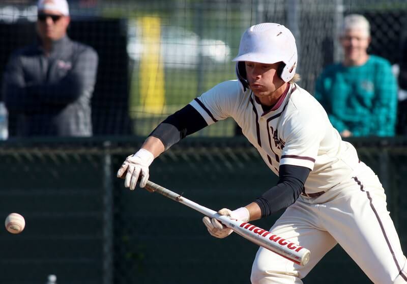 Prairie Ridge’s Mason McKim bunts against Woodstock North in Class 3A Regional baseball action at Cary Thursday.