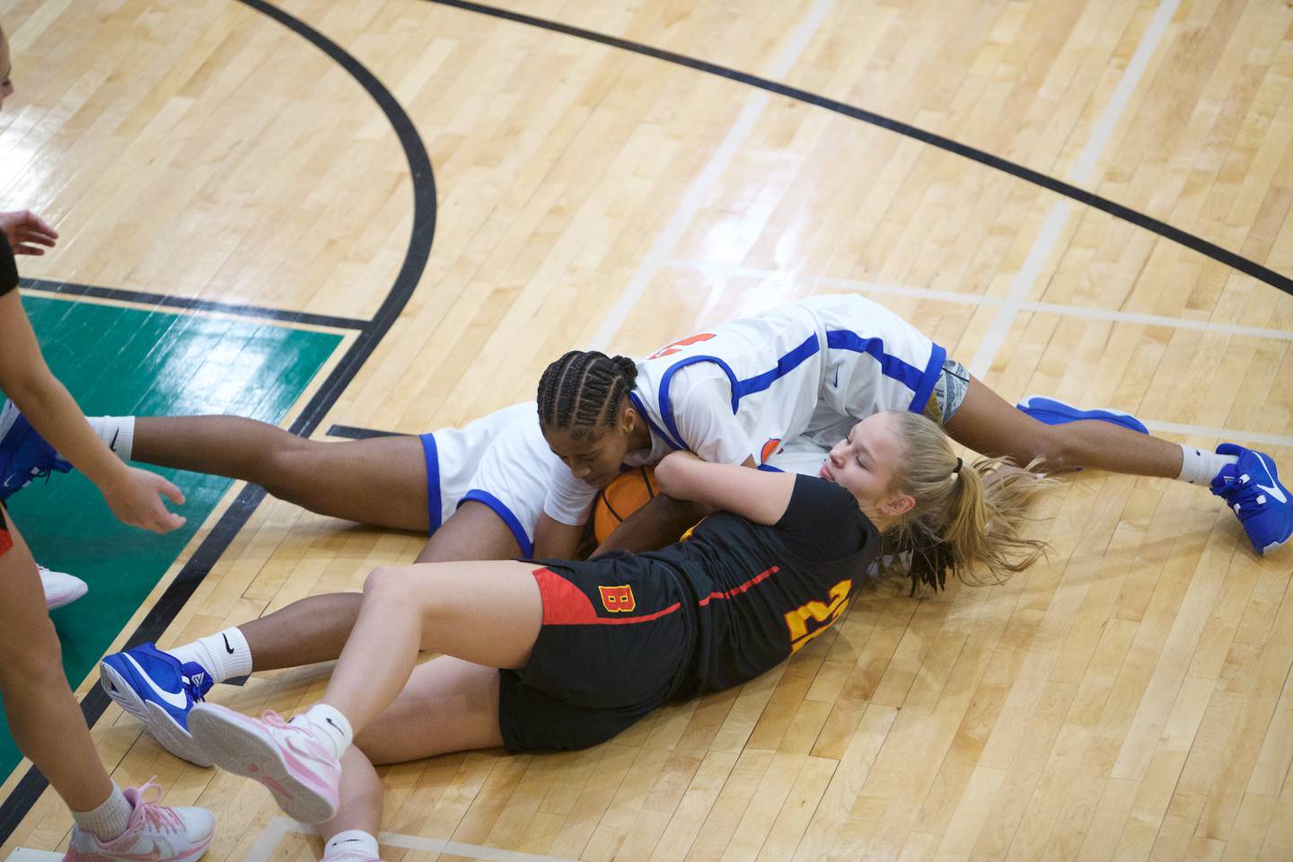 Batavia's Ali Thomas battles for the loose ball with Butler's Samalyya Williams during the Dave Yates Chicagoland Showcase on Saturday, Dec7,2024 at Fremd in Palatine.