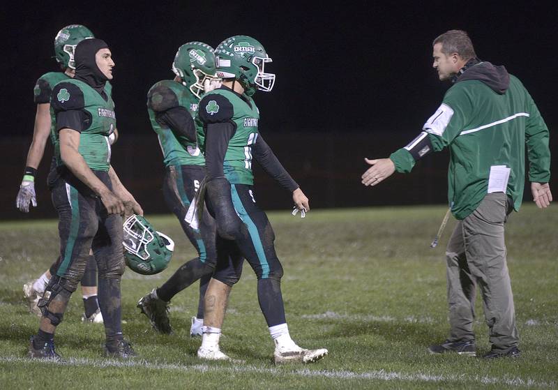 Seneca football coach Terry Maxwell lauds his team during a timeout of their first-round playoff win at home.