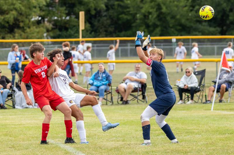 (from left) Eddie Devera (9) of Streator locks arms with Johan Cortez (10) of Mendota as he kicks ball over Goalkeeper Seth Zito (0) of Streator on Saturday, Aug 30, 2025 at the James Street Recreation Area in Streator.
