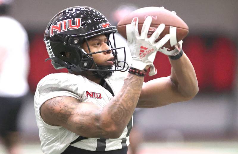 Northern Illinois receiver Messiah Travis catches a pass during the teams first spring practice Wednesday, March 22, 2023, in the Chessick Practice Center at Northern Illinois University in DeKalb.