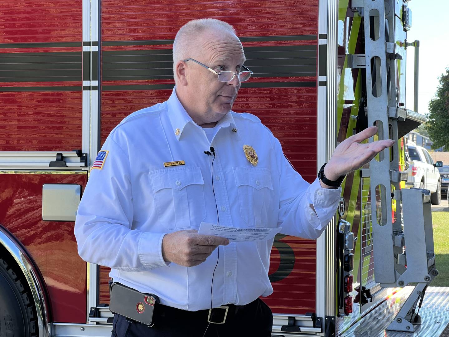 DeKalb Fire Department Fire Chief Mike Thomas talks with firefighters at Station Three during the Oct. 3, 2022 dedication of the new Engine Three.