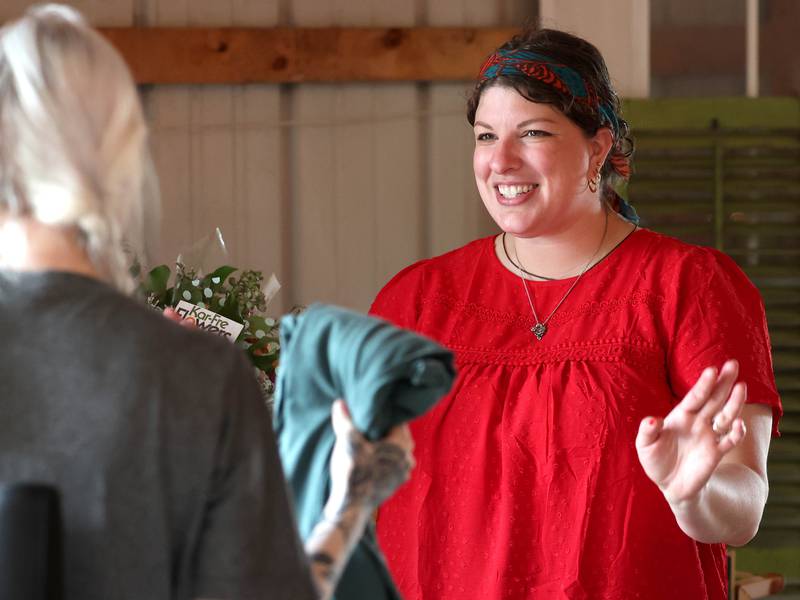 Adrienne Leach, owner of Kar-Fre Flowers, talks to a customer Tuesday, June 3, 2025, during the the Sycamore Farmers Market, hosted by Kar-Fre Flowers and Gifts. The market will be held Tuesdays from 3-6 p.m. through August 26 at Kar-Fre Flowers. Some of the market was held indoors due to the weather.
