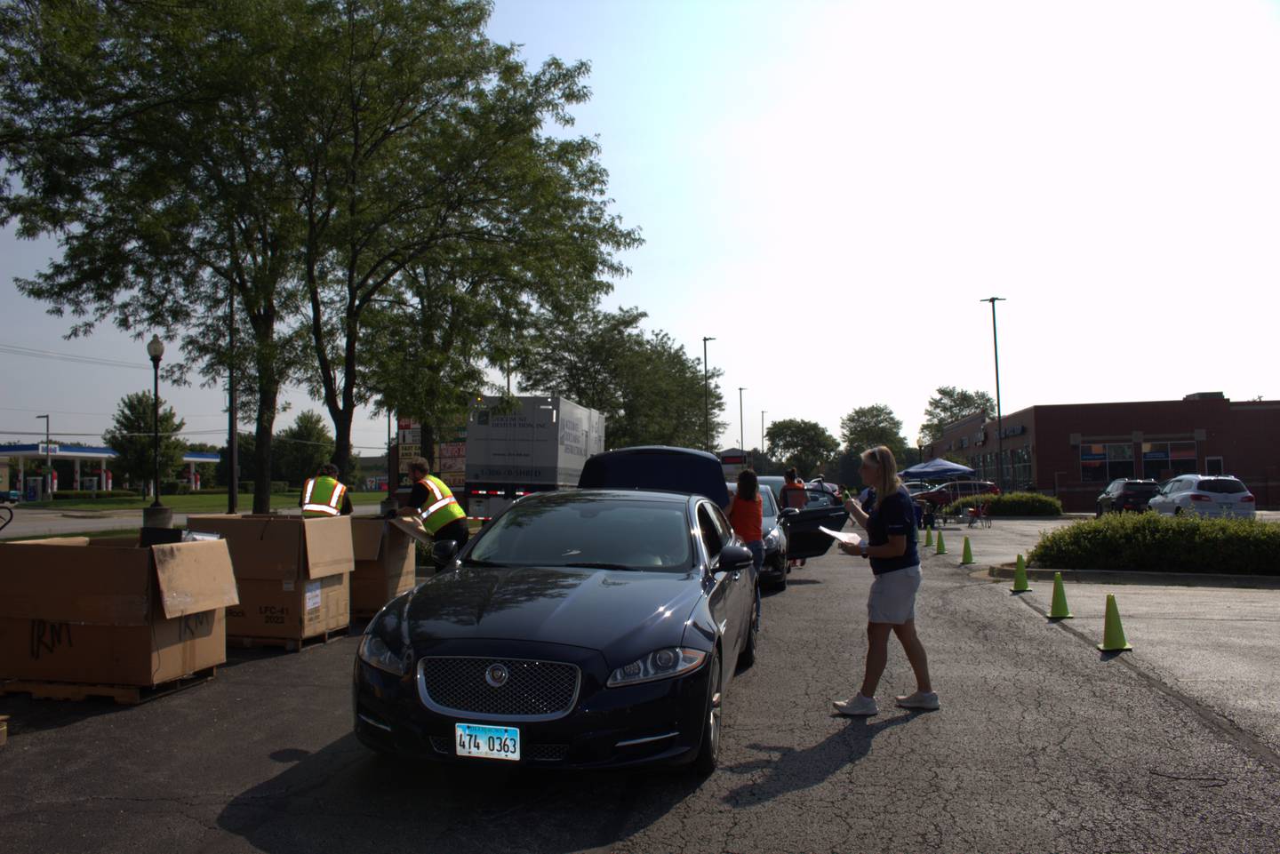 Volunteers check in cars as they line up to make donations at State Rep. Stephanie Kifowit’s, D-Oswego, 12th annual Community Recycle & Shred Day in Aurora on July 13, 2024.