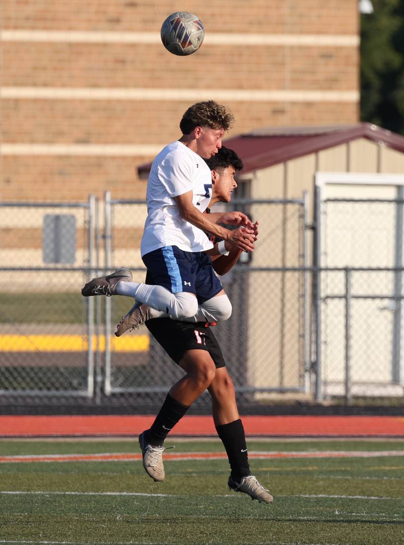 Guilford's Daniel Martinez heads the ball over DeKalb's Nathan Ramirez during their game Thursday, Sept. 18, 2025, at Dekalb High School.