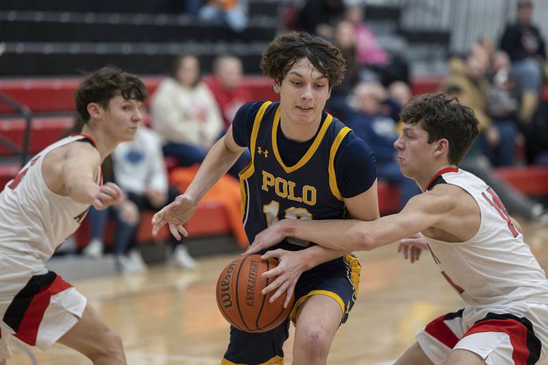 Polo’s Carter Merdian has the ball knocked away by Amboy’s Kyler McNinch Wednesday, Jan. 25, 2023.