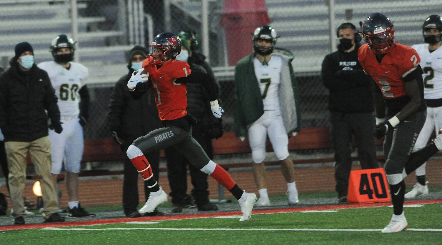 Palatine's Jake Bostick returns the opening kickoff for a touchdown against Fremd during the spring season.