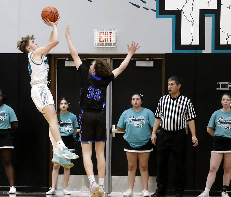 Woodstock North's Trevor Mark shoots the ball over Woodstock's Samuel Chapman during a Kishwaukee River Conference boys basketball game on Friday, Jan. 5. 2024, at Woodstock North High School.