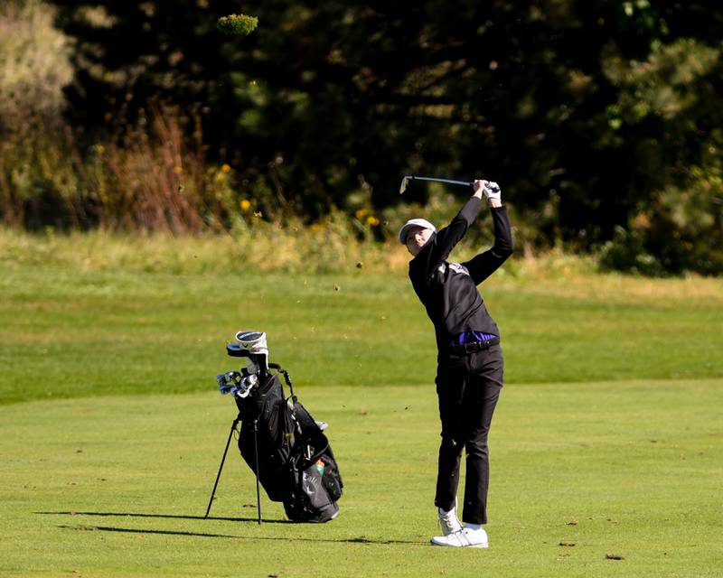 Downers Grove North's watches as he hits his ball from the fairway to get an eagle on Monday Oct. 7, 2024, during the 3A sectional match held at Blackberry Oaks Golf Course in Bristol.