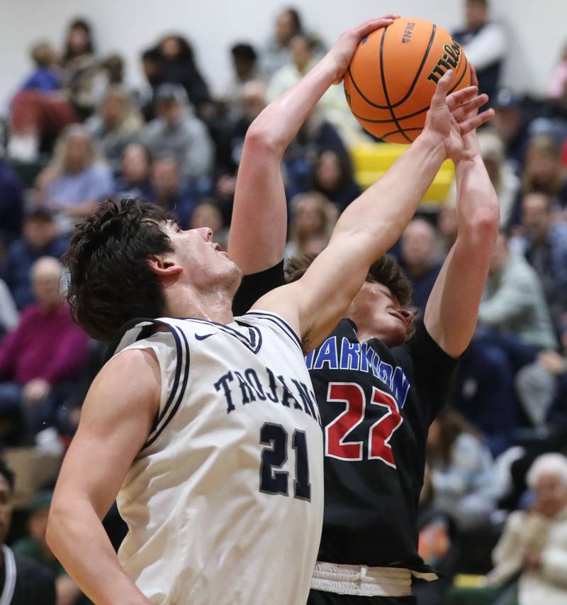 Cary-Grove's Brady Elbert battles with Marmion's Colin McEniry for a rebound during an IHSA Class 3A Crystal Lake South Regional boys basketball semifinal game on Wednesday, February, 25, 2026, at Crystal Lake South High School.